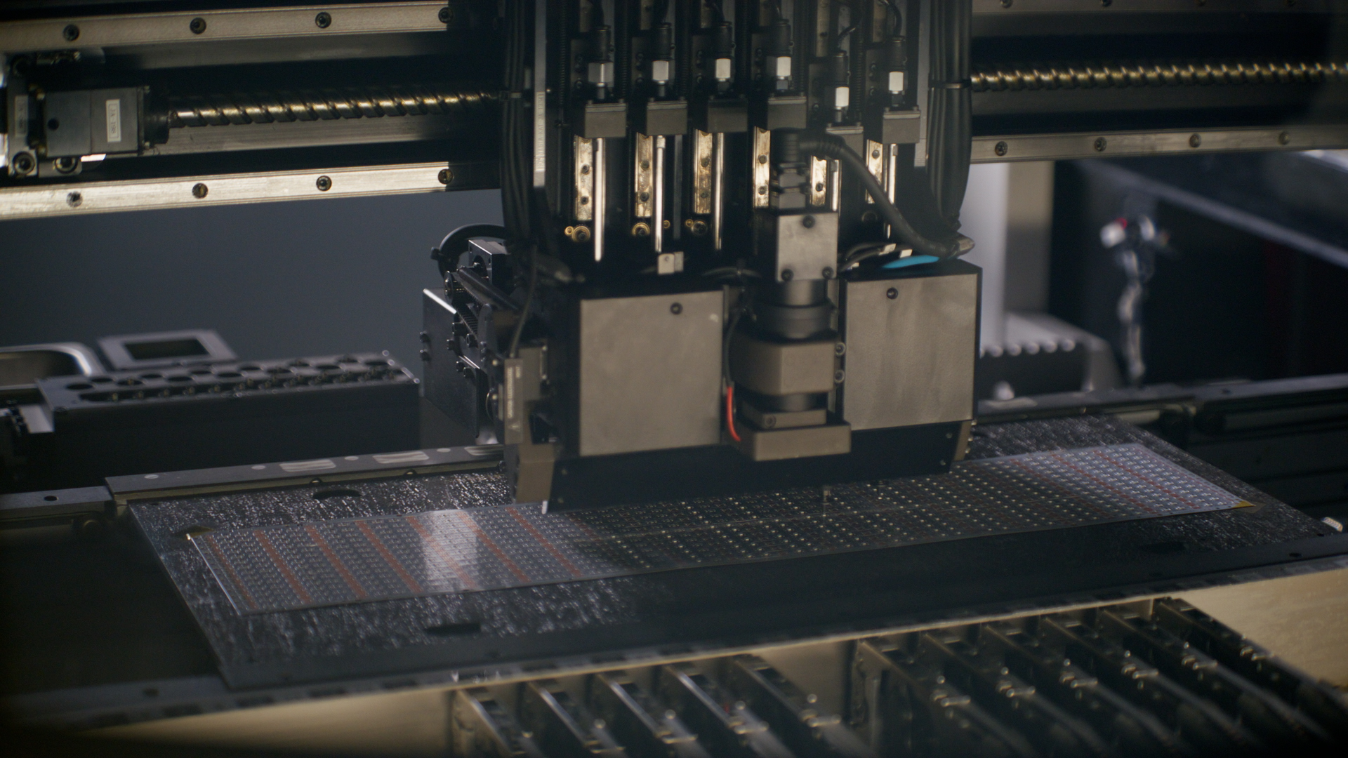 high-speed Surface Mount Technology (SMT) machine in action, ensuring precision and quality in every PCB assembly.