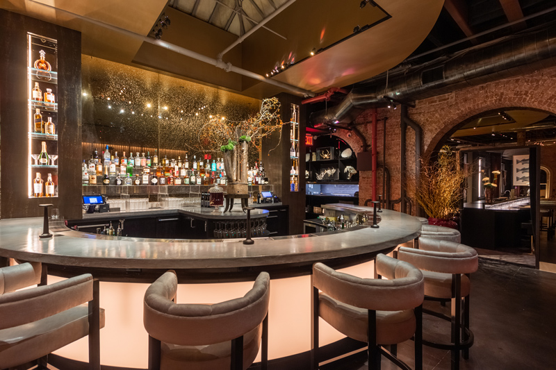 An endlessly supplied bar glows of diffused warm white light